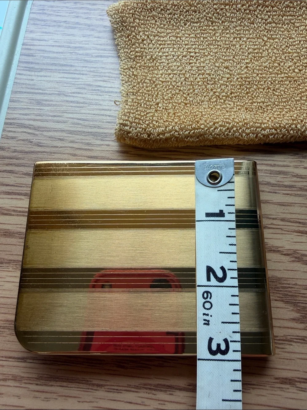 Vintage Elgin American cigarette case features a striking striped gold pattern